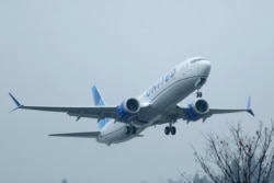 FILE - A United Airlines Boeing 737 Max airplane takes off in the rain at Renton Municipal Airport in Renton, Wash., Dec. 11, 2019,