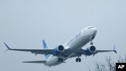FILE - A United Airlines Boeing 737 Max airplane takes off in the rain, Dec. 11, 2019, at Renton Municipal Airport in Renton, Wash. 
