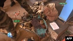 This video grab obtained by AFPTV from Office de Radiodiffusion-Télévision du Mali (ORTM) on September 17, 2024 shows clothes and boots in Bamako.