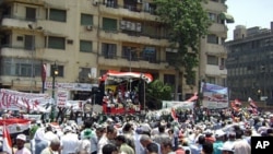 Protesters gather in front of a stage in Tahrir Square, July 15, 2011