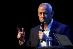 FILE - Benny Gantz, the leader of Blue and White party, speaks at an event hosted by the Tel Aviv International Salon ahead of general elections, in Tel Aviv, Israel, Sept. 9, 2019.