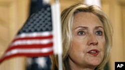 U.S. Secretary of State Hillary Clinton, left, speaks during a joint news conference with Pakistan's Foreign Minister Hina Rabbani Khar in Islamabad, Pakistan, October 21, 2011.