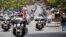 FILE - Patriot Guard Riders escort a motorcade carrying 200 POWs for the 40th anniversary of the homecoming of Vietnam POWs at Richard Nixon Presidential Library and Museum in Yorba Linda, California, May 23, 2013.