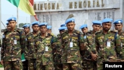 FILE - U.N. peacekeepers attend a memorial ceremony for their comrades at the MINUSMA base in Bamako, Mali, Sept. 27, 2017. 