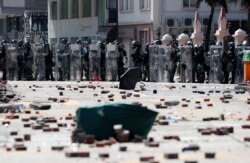 Riot police officers stand during clashes with protesters outside Hong Kong Polytechnic University in Hong Kong, Nov. 17, 2019.