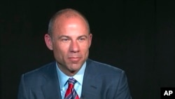 FILE - In this image from video, Michael Avenatti, attorney and spokesperson for adult film star Stormy Daniels, listens to a reporter's question during an interview in New York, March 21, 2018.