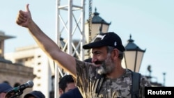 Armenian opposition leader Nikol Pashinyan gestures to his supporters at a rally in Yerevan, Armenia, May 2, 2018. 