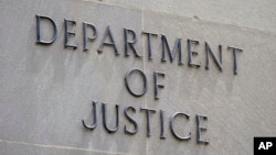 FILE - The outside of the Justice Department building in Washington. The department, which President Donald Trump says has previously been "weaponized" against him, will undergo a "fundamental change in mindset and approach," the new attorney general says.