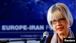 FILE - Helga Schmid, secretary general of the European External Action Service, addresses the 4th Europe-Iran Forum in Zurich, Oct. 4, 2017. 