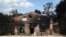 A burned house is seen in Agios Andreas, east of Athens, Tuesday, July 24, 2018. 