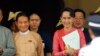 FILE - Win Myint, newly elected president of Myanmar, left, and Myanmar's leader Aung San Suu Kyi leave the parliament in Naypyitaw, Myanmar, March 28, 2018. 
