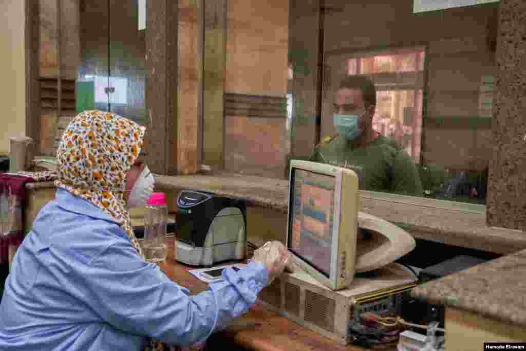 A ticket taker at Cairo's main train station wears protective gear in this March 24, 2020 photo. (VOA/H. Elrasam)