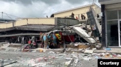 FILE - in this screengrab taken from a social media video, rubble surrounds a collapsed Port Vila, Vanuatu, building after a Dec. 17, 2024, earthquake. (Jeremy Ellison/via Reuters)