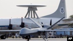 FILE - Predator B unmanned aircraft taxis at the Naval Air Station in Corpus Christi, Texas.