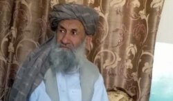 Mullah Hassan Akhund is seen in an undated photo released by the Taliban’s media team.