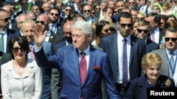 Former U.S. President Bill Clinton and Madeleine Albright walk during the 20th anniversary of the Deployment of NATO Troops in Kosovo in Pristina, Kosovo, June 12, 2019. 