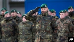 German Bundeswehr soldiers of the 12th Mechanized Infantry Brigade, 122nd Infantry Battalion, take part in a NATO enhanced forward presence battalion welcome ceremony at the Rukla military base 130 km (80 miles) west of Vilnius, Lithuania, Feb. 7, 2017.