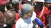 A WASP leader, Liv Shange, is surrounded by striking workers as she ta;sl to reporters media during a protest near Johannesburg. (Courtesy WASP)