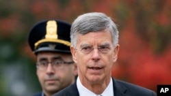 Ambassador William Taylor is escorted by U.S. Capitol Police as he arrives to testify before House committees as part of the Democrats' impeachment investigation of President Donald Trump, at the Capitol in Washington, Oct. 22, 2019.