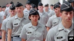 FILE - Citadel cadets march in formation at the military college in Charleston, S.C.