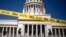 Caution tape blocks the street at the entrance of the National Capitol building in Havana, Cuba, July 13, 2021. 