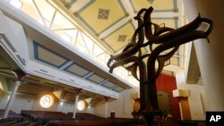 An empty sanctuary awaits parishioners on Palm Sunday at Saint Mary's Catholic Church Sunday April 5, 2020, in Richmond, Va.