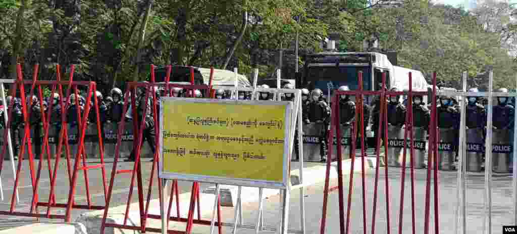 Riot police are seen blocking a road in Yangon, Myanmar, Feb. 9, 2021. (Credit: VOA Burmese Service)