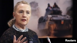 U.S. Secretary of State Hillary Clinton addresses a news conference during a NATO foreign ministers meeting in Brussels, Belgium, December 5, 2012. 