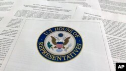The report from Democrats on the House Intelligence Committee on the impeachment inquiry into President Donald Trump is photographed in Washington, Dec. 3, 2019. 