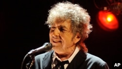 FILE - In this Jan. 12, 2012 file photo, Bob Dylan performs in Los Angeles. 