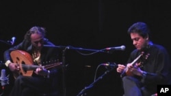 Iraqi musician Rahim Al Haj and Amir Koushkani of Iran join to play together as part of the Cultural Olympiad music program
