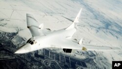 FILE - A Tupolev-160 warplane is seen during combat training flight near the Engels air force base in the Saratov region, about 700 km southeast of Moscow. 