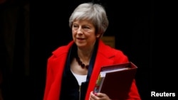 Britain's Prime Minister Theresa May leaves 10 Downing Street in London, Nov. 28, 2018.