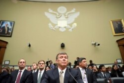 Acting Director of National Intelligence Joseph Maguire takes his seat before testifying before the House Intelligence Committee on Capitol Hill in Washington, Sept. 26, 2019.