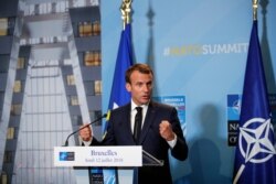 FILE - French President Emmanuel Macron speaks at a press conference at NATO headquarters in Brussels, Belgium, July 12, 2018.
