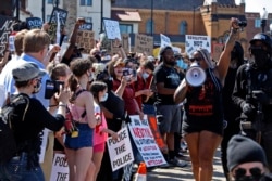FILE - Protesters participate in a Black Lives Matter rally on Mount Washington in Pittsburgh, June 7, 2020, to protest the death of George Floyd, who died May 25 after being restrained by police in Minneapolis.