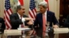 U.S. Secretary of State John Kerry and Iraqi Foreign Minister Hoshyar Zebari (L) shake hands at the Diplomatic and Political Joint Coordinating Committee meeting at the State Department in Washington, August 15, 2013. 