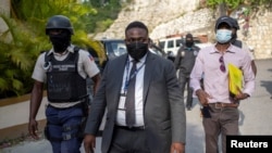 Carl Henry Destin, a Haitian justice of the peace, leaves the residence of late President Jovenel Moise after FBI agents assisted with investigations inside the property in Port-au-Prince, Haiti, July 15, 2021.