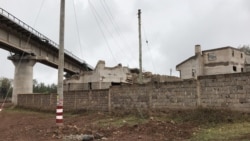 The railway line construction by the Chinese goes through people's lands and homes, forcing the government to pay millions in compensation. (M. Yusuf/VOA)