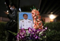 A portrait of Thailand Prime Minister Prayuth Chan-Ocha is pictured during a protest after the constitutional court's ruling on the prime minister's conflict of interest case, in Bangkok, Thailand, Dec. 2, 2020.