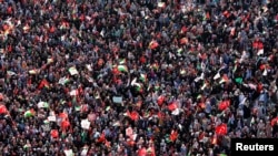 People wave Turkish and Palestinian flags during a protest against Israel, in Istanbul, Turkey, July 30, 2017.