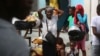 Masses of residents flee homes in Haiti's capital as gangs ratchet up violence