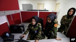 From left, Second Lieutenant Roshan Gul, First Lieutenant Nelofar Frotan and Second Lieutenant Morsal Afshar work at the human resources office in the Ministry of Defense in Kabul, Afghanistan, Oct. 31, 2016. 