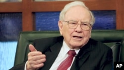 FILE - Berkshire Hathaway Chairman and CEO Warren Buffett speaks during an interview with Liz Claman on the Fox Business Network in Omaha, Neb.
