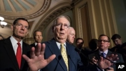 Senate Majority Leader Mitch McConnell, R-Ky., joined by, from left, Sen. John Barrasso, R-Wyo., Sen. John Thune, R-S.D., and Majority Whip John Cornyn, R-Texas, speaks following a closed-door strategy session, at the Capitol in Washington, June 20, 2017.