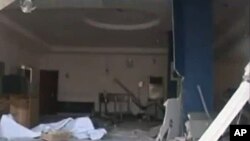 In this image made from television released by the state-run Nigerian Television Authority, Nov. 6, 2011, a damaged building is seen in Damatura, Nigeria, following a series of coordinated attacks Friday.