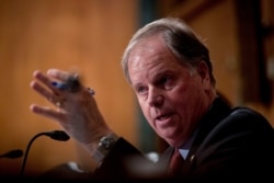 FILE - Sen. Doug Jones, D-Ala., speaks on Capitol Hill in Washington, September 10, 2019.