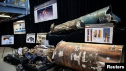 FILE - A U.S. Department of Defense exhibit shows a "Qiam" ballistic missile manufactured in Iran, at a military base in Washington, Nov. 29, 2018. 