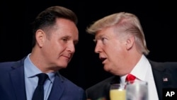 FILE - President Donald Trump, right, talks with television producer Mark Burnett during the National Prayer Breakfast, Feb. 2, 2017, in Washington. 