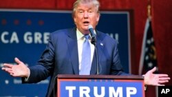 Republican presidential candidate Donald Trump speaks during a campaign rally held at the North Atlanta Trade Center, Oct., 10, 2015, in Norcross, Ga. 